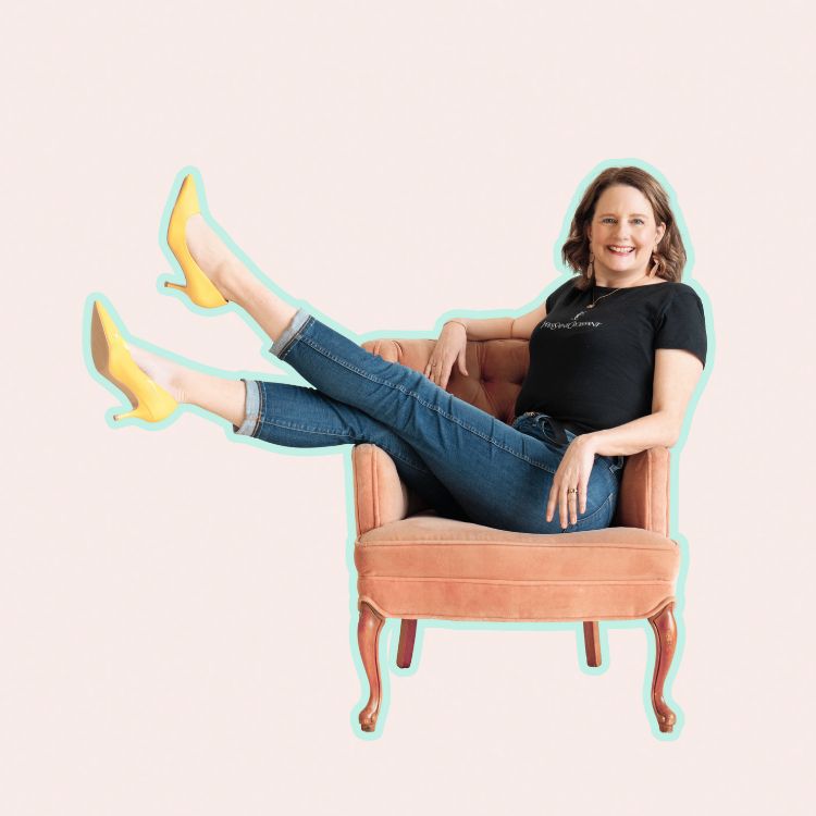 Woman siting in a chair sideways with her legs up on the armrest. A good brand photographer will guide you so that you can show up confident, prepared, and ready to shine on your session day.