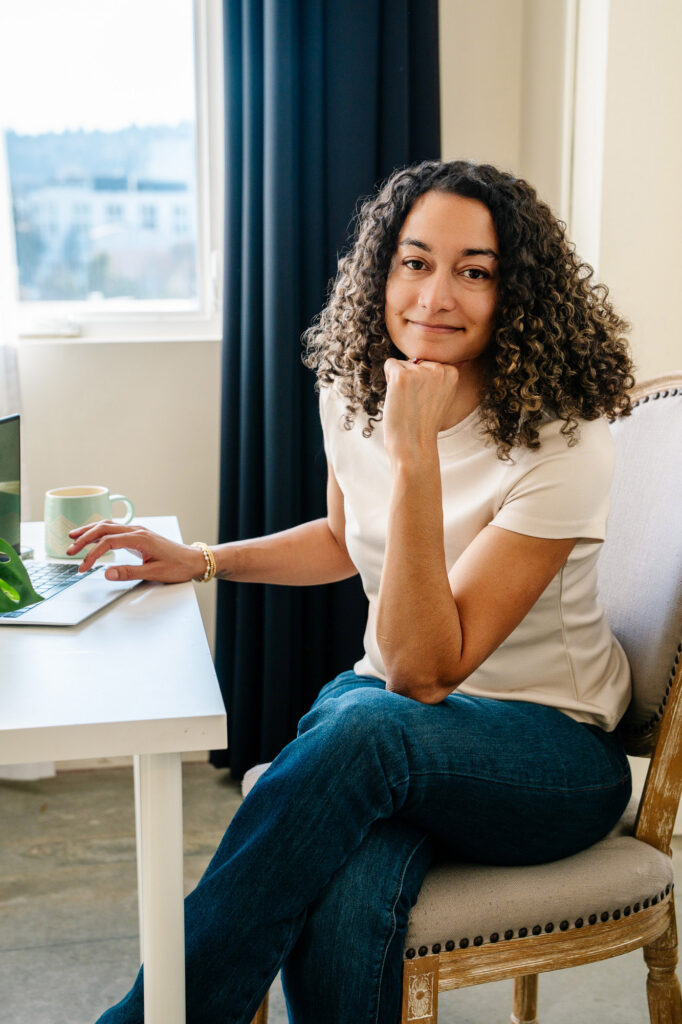 Therapist sitting at a desk with her laptop