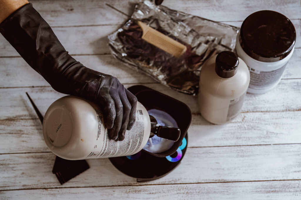 Professional brand photography of hairstylist mixing color, illustrating elevated branding beyond DIY brand photos for creative entrepreneurs