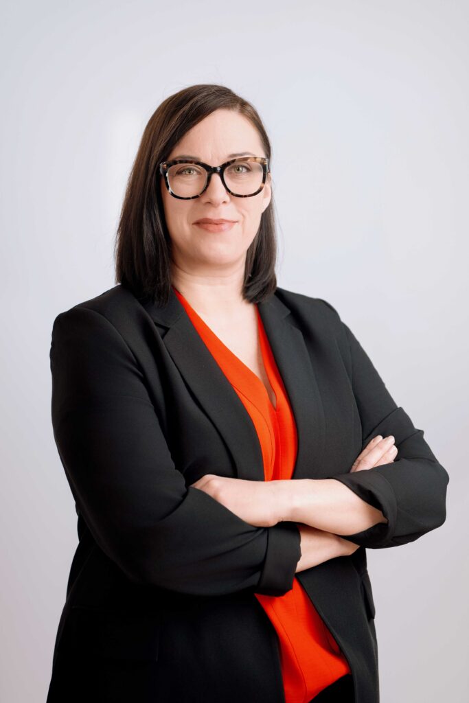 Headshot of a woman entrepreneur in Portland standing with her arms crossed