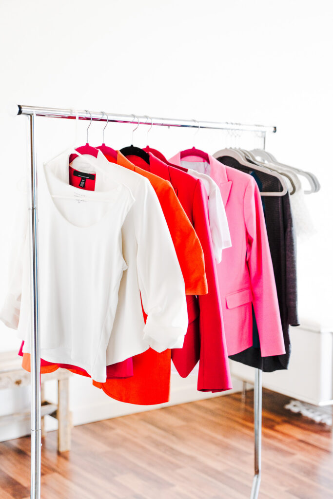 A rack of clothing options for what to wear to your brand photoshoot